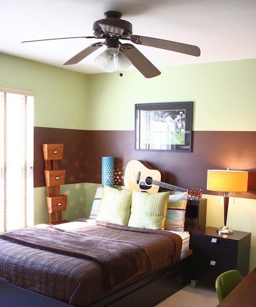 Teenager's bedroom painted green with a single wide horizontal brown stripe