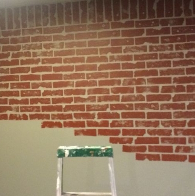 Faux painted brick created with a kitchen sponge