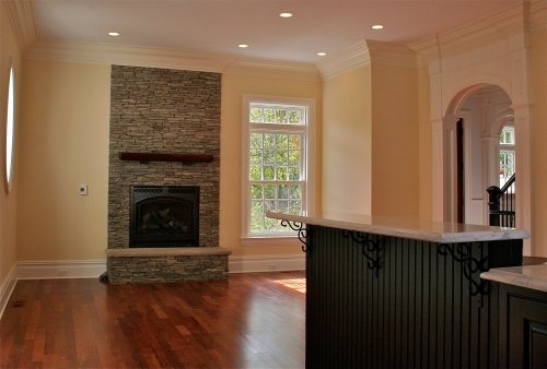 Open floor area painted the same soft yellow color