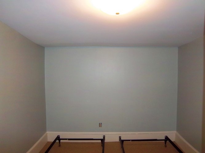 After: painted walls look more peaceful in bedroom