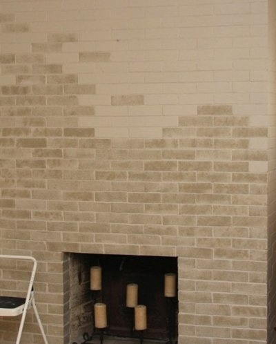 Fireplace brick wall enhanced with subtle paint sponging
