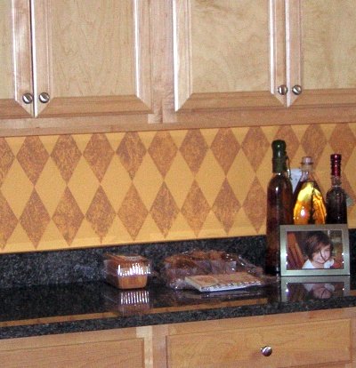 Kitchen backsplash decorated with a sponged on harlequin pattern